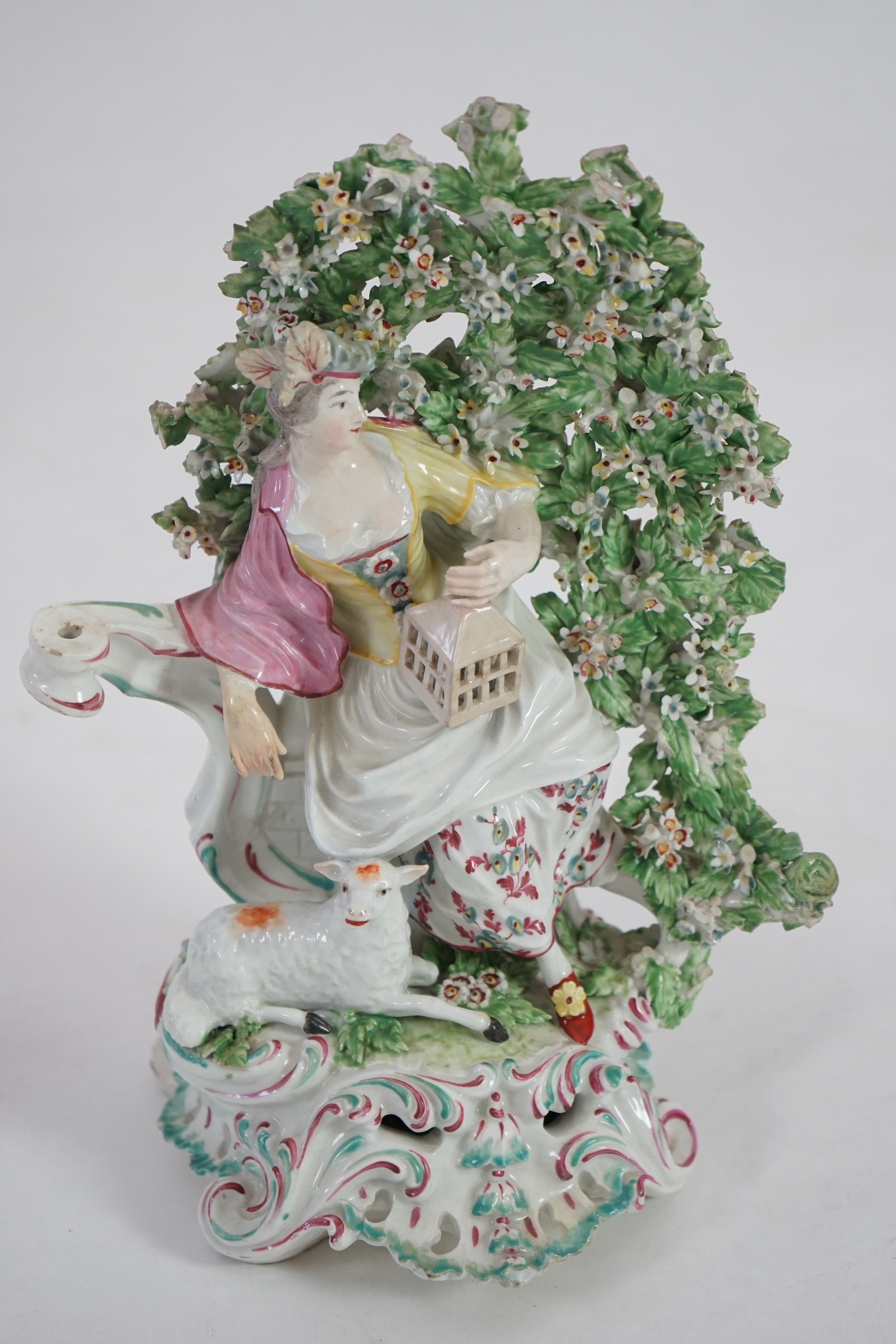 A Derby figure of a seated lady with birdcage and lamb, c.1770-75